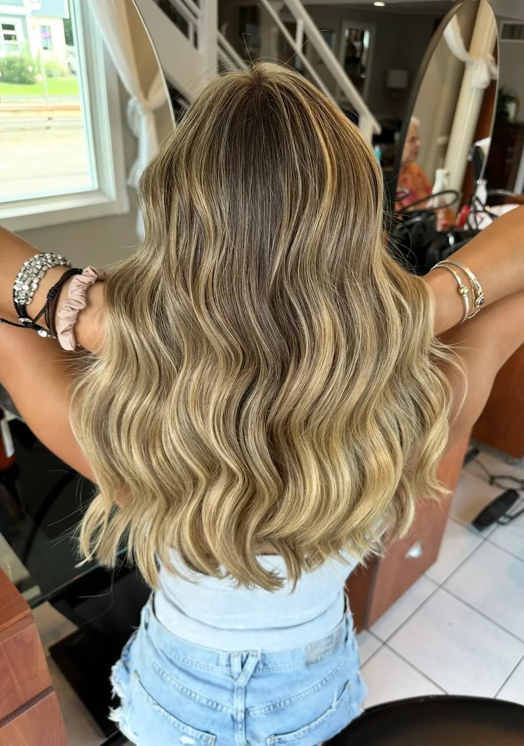 Bright blonde balayage with beachy waves