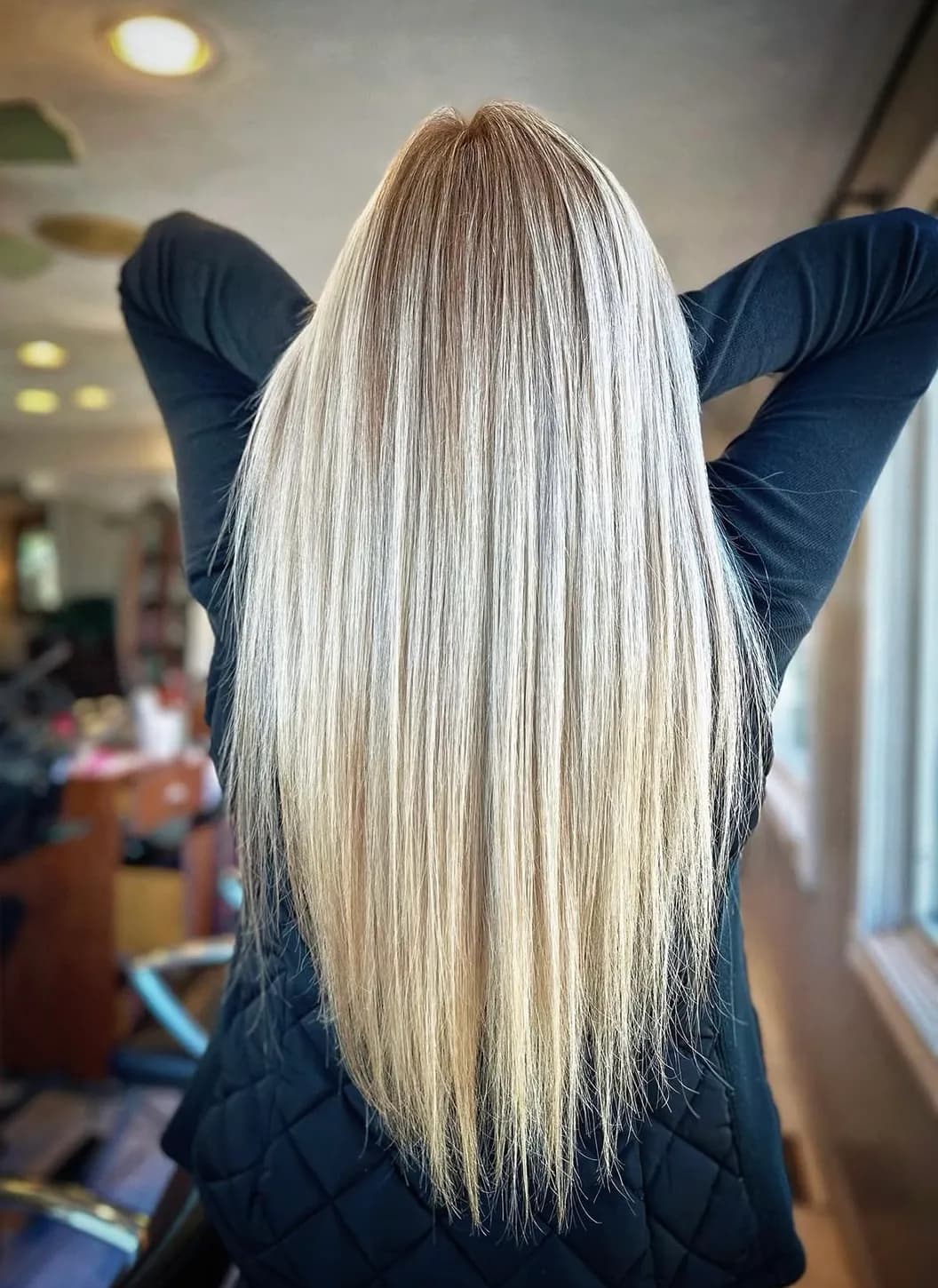 Long, straight dimensional blonde color by Solene Hair